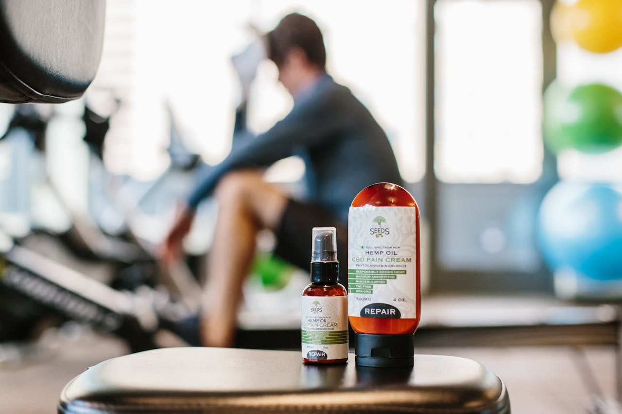 our-services-3 Close-up of hemp oil products in a gym focus on wellness and recovery.